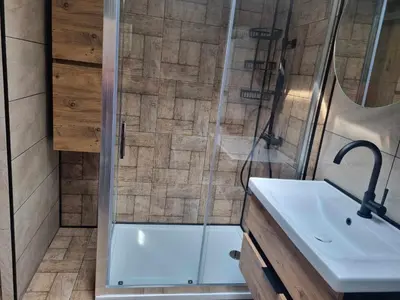 a bathroom with a shower and a sink at Guesthouse Djulia in Ghent