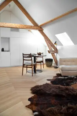 a living room with a table and a couch at Galalith in Antwerp