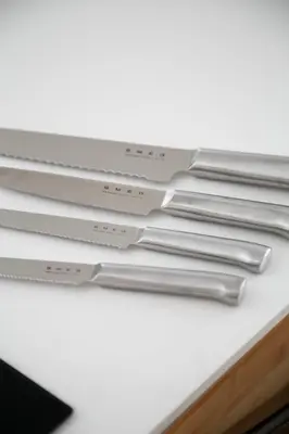 a pile of stainless steel utensils sitting on a table at Galalith in Antwerp