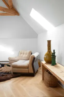 a living room with a chair and a table at Galalith in Antwerp