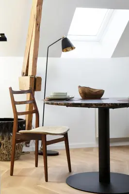 a table and a chair in a room at Galalith in Antwerp
