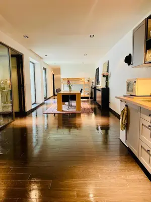 a kitchen with a table in the middle of a room at Loft Retreat in Brussels