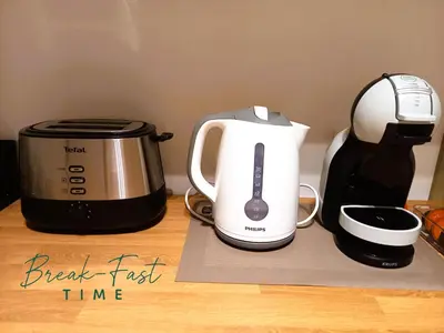 a coffee maker and a toaster on a counter at Comfy Stay 9052 in Ghent