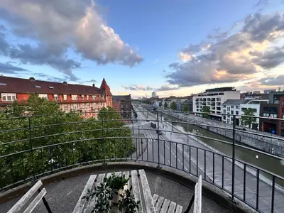 a bridge over a river in a city with buildings at 2 Bedroom Apartment in Center with Breathtaking View in Brussels