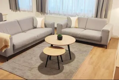a living room with a couch and a table at 2 Bedroom Apartment in Center with Breathtaking View in Brussels