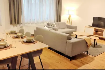 a living room with a couch and a table at 2 Bedroom Apartment in Center with Breathtaking View in Brussels