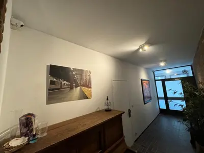 a room with a wall with a picture on the wall at Loft with big terrace city center MEIR in Antwerp