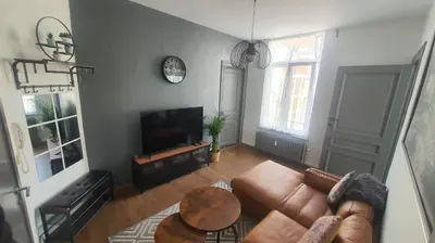 a living room with a couch and a table at ailes Center 1 in Brussels