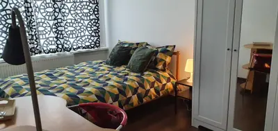 a bedroom with a bed and a window at Lovely room in Mortsel