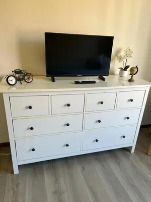 a white dresser with a television on top of it at Coeur de Bruxelles, Grand-Place et Mannekenpiss in Brussels