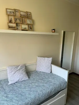 a bedroom with a bed with two pillows on it at Coeur de Bruxelles, Grand-Place et Mannekenpiss in Brussels