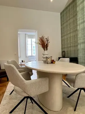 a dining room with a table and chairs at Stilias Apartment 4P Brussels City in Brussels