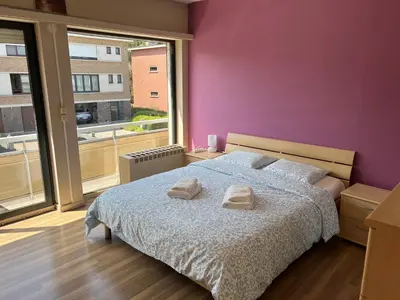 a bedroom with a bed with two towels on it at Rooms for Tomorrowland 2026 in Boom