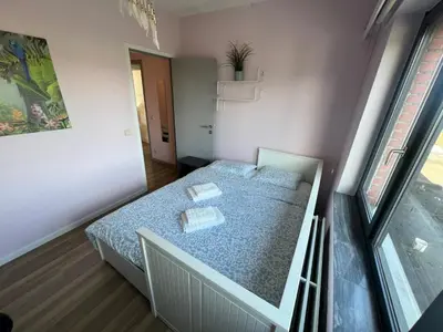 a small bedroom with a bed in a room at Rooms for Tomorrowland 2026 in Boom