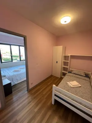 a bedroom with a bed and a large window at Rooms for Tomorrowland 2026 in Boom