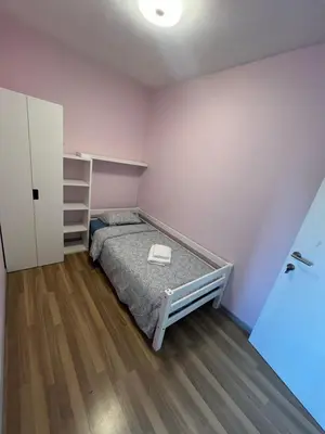 a small bedroom with a bed and a closet at Rooms for Tomorrowland 2026 in Boom