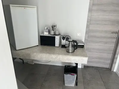 a kitchen with a counter top with a microwave at Rooms for Tomorrowland 2026 in Boom