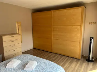a bedroom with a bed and a large closet at Rooms for Tomorrowland 2026 in Boom