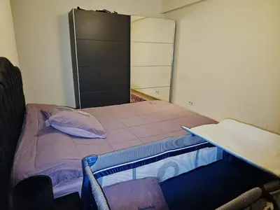 a small room with a bed and a cabinet at Luxurious 4 in Brussels