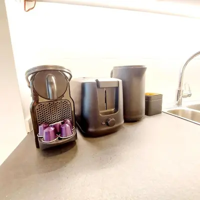 a kitchen counter with a blender on a counter top at New Luxe Grand place Apartment in Brussels