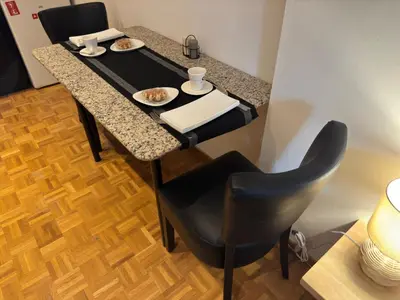 a table with two plates of food on it at Two bedroom loft in the city center by the Meir in Antwerp