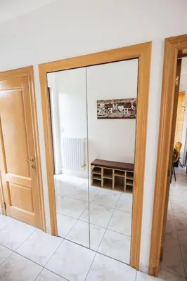 a sliding glass door in a room with a room with at Résidence Orchidée in Zaventem