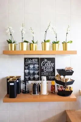 a counter with a chalkboard and a coffee table with food at Résidence Orchidée in Zaventem