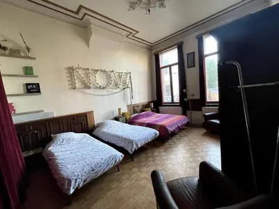 a living room with two beds and a couch at Spacy Room in Old Townhouse Relaxed Vibe with LATE Check-out! in Ghent