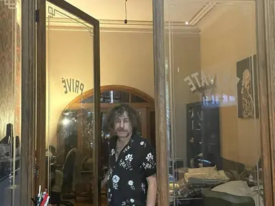 a man standing in front of a mirror at Spacy Room in Old Townhouse Relaxed Vibe with LATE Check-out! in Ghent