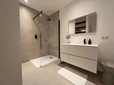 a bathroom with a shower and a sink and a toilet at House of Legend in Antwerp