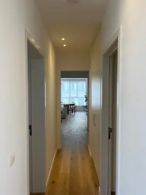 an empty hallway with a dining room and a table at House of Legend in Antwerp