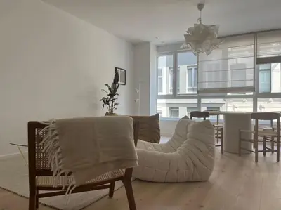 a living room with two chairs and a table at House of Legend in Antwerp