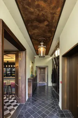 a hallway with a tile floor and a ceiling at B&B CONVENT Begijnhof Herentals in Herentals