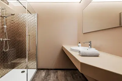 a bathroom with a sink and a shower at B&B CONVENT Begijnhof Herentals in Herentals