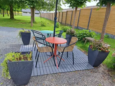 a table and chairs sitting on a patio at Apartment Capitalcondos in Ninove