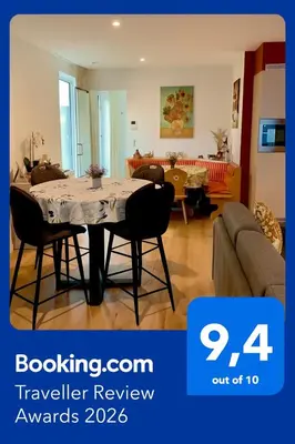 a living room with a table and a couch at Olivia in Lier