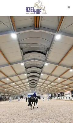 a man riding a horse inside of a building at Olivia in Lier
