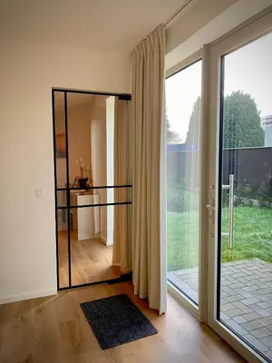 a room with a large glass door with a view at Olivia in Lier