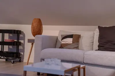 a living room with a couch and a table at FLAX ANTWERP in Antwerp