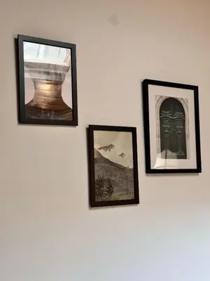 four pictures hanging on a white wall at Studio n3 Bruxelles Centre Ville in Brussels