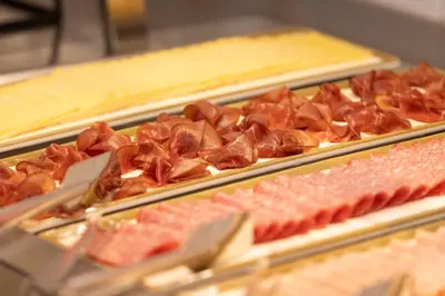 a bunch of different types of food on display at Holiday Inn Express Brussels - Airport by IHG in Diegem