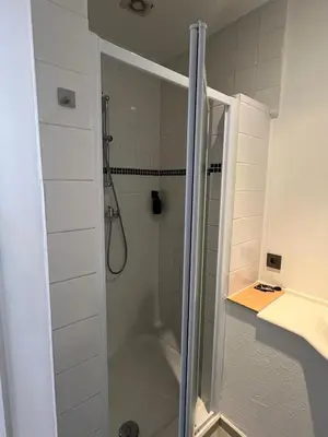 a bathroom with a shower and a tub at European District Apartment Thirteen in Brussels
