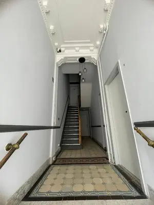 a staircase in an old building with a stair case at European District Apartment Thirteen in Brussels