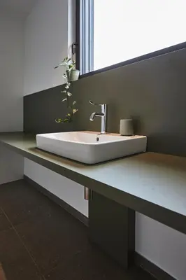 a bathroom counter with a sink and a mirror at Vakantiewoning Het Kasterhuis in Wetteren