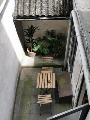 an overhead view of two benches and potted plants at Cozy city centre room with parkview in Ghent