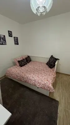 a bedroom with a bed with a comforter and pillows at Two bedroom flat - Hyper Center Brussels in Brussels