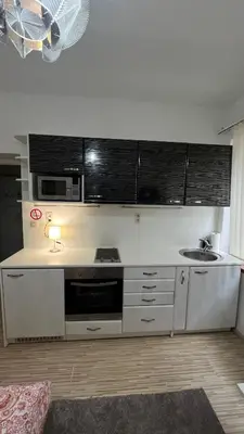 a kitchen with a sink and a microwave at Two bedroom flat - Hyper Center Brussels in Brussels