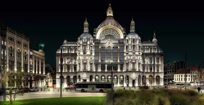 a large building with a bus in front of it at Heart of Antwerp in Antwerp