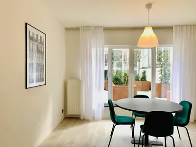 a dining room with a table and chairs at Belfort Shortstay in Ghent