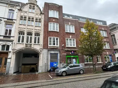 a building with a car parked in front of it at Belfort Shortstay in Ghent